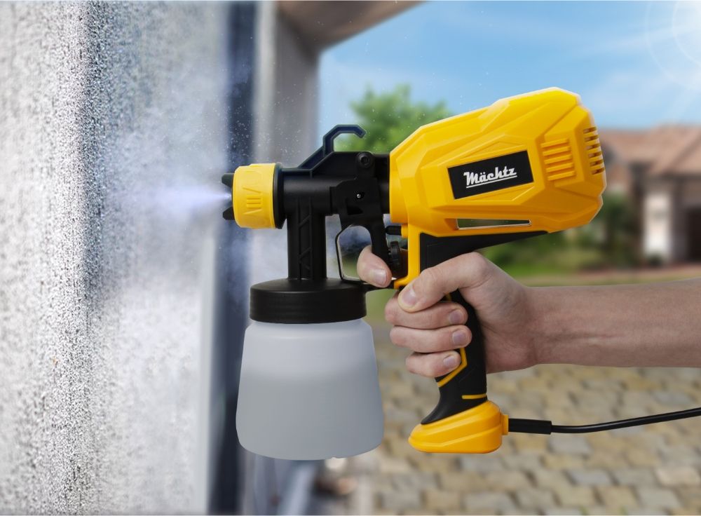 Фарбопульт у процесі фарбування стіни