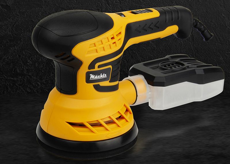 Шліфмашина на темному фоні